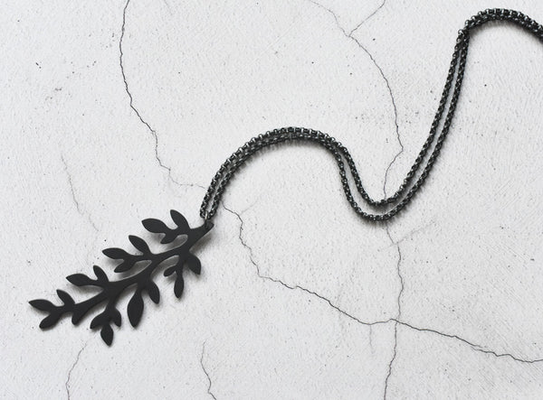 angle view of sterling black leaves necklace